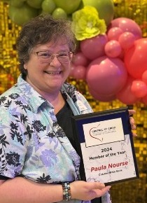 Paula Nourse from our Roberts Branch happily holding her Member of the Year award that she received from the St. Croix Central Chamber.